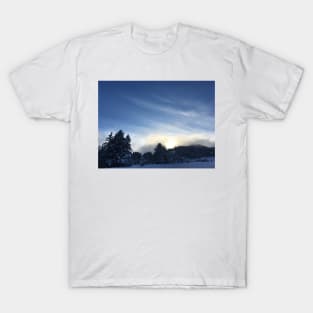 Sunset over a snow covered mountain T-Shirt